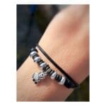 DoDo Bracciale Cordino Dieci rondelle in titanio, cinque bold in argento e ciondolo Panda in argento e diamanti