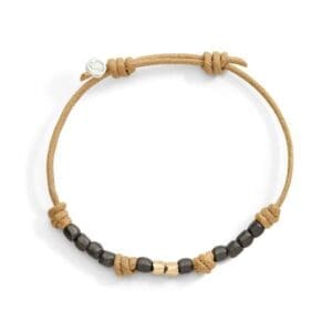 DoDo Bracciale Cordino Sottile con due mini granelli in oro giallo 9k e dieci mini granelli in titanio