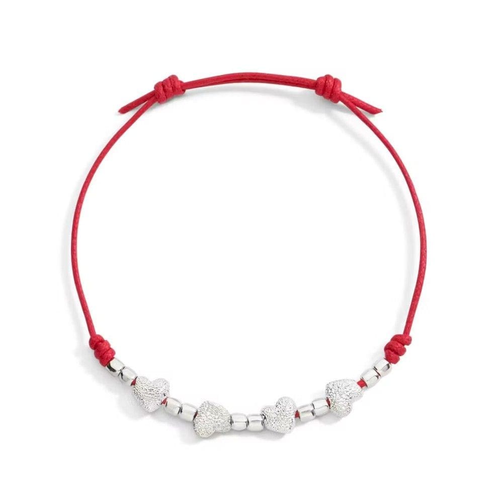 DoDo Bracciale Cordino Sottile con quattro cuori in argento diamantato e dieci mini granelli in argento - immagine 1